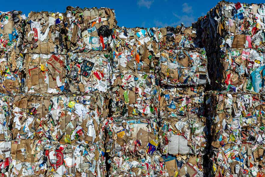 Fiber bales stacked for recycling.